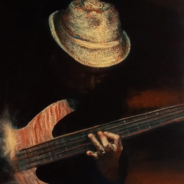 A musician wearing a textured hat plays a bass guitar, focusing on the strings. The scene is dimly lit, highlighting the instrument and hands.