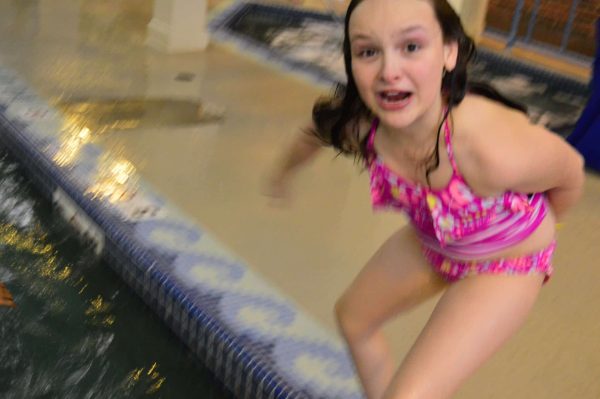 girl about to jump in a pool